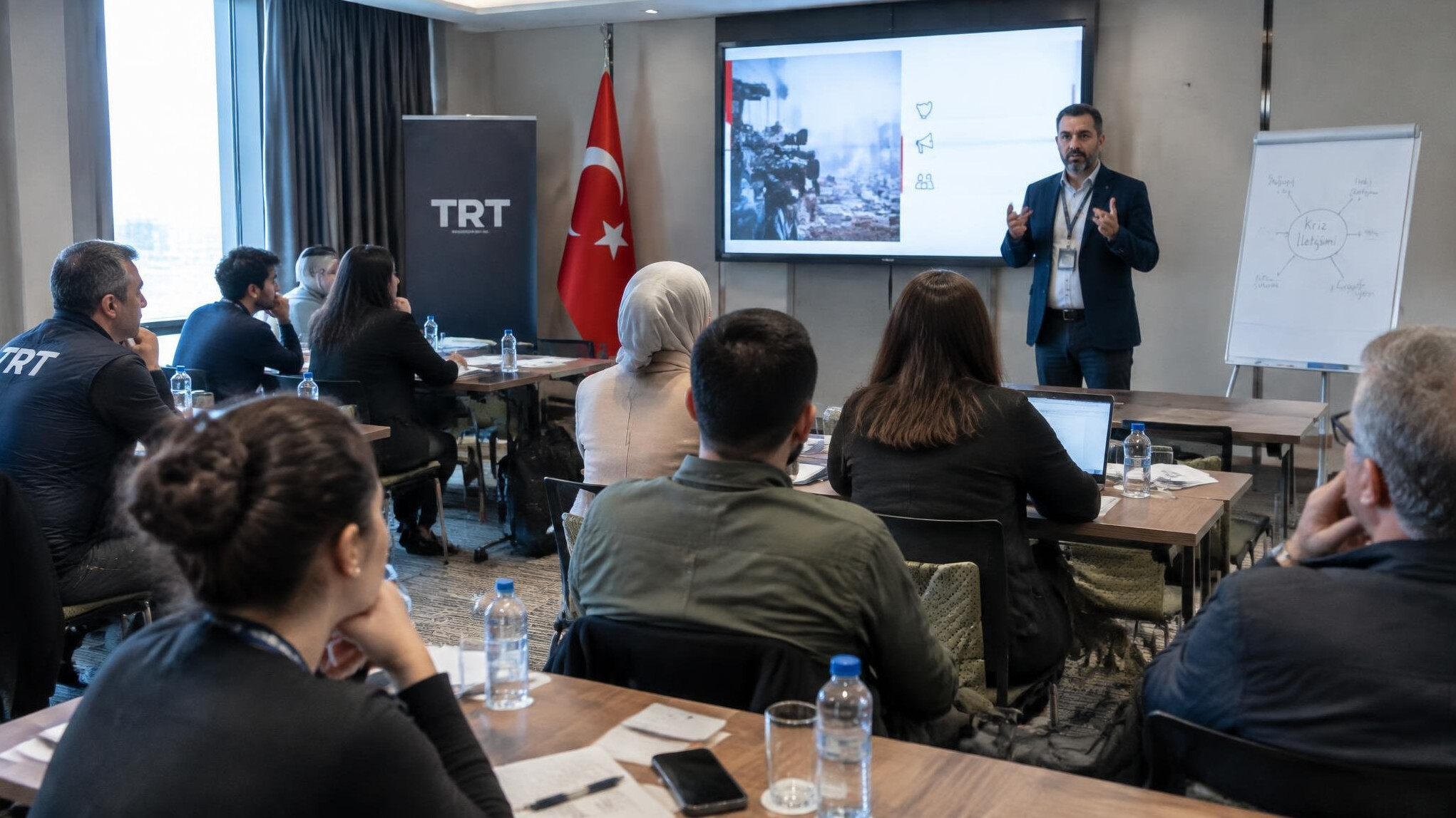 Group training session on crisis communication for broadcast staff